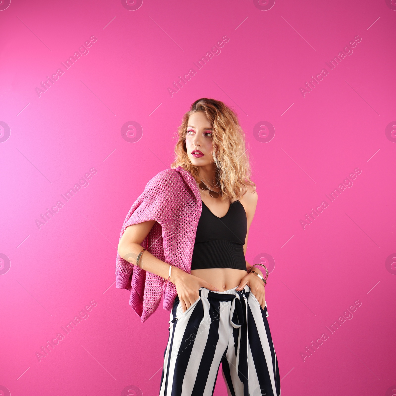 Photo of Beautiful young woman posing on color background. Summer fashion