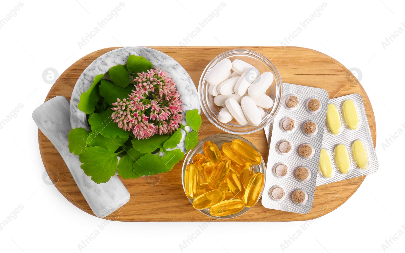 Photo of Board with mortar, fresh herbs and pills on white background, top view