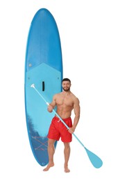 Happy man with blue SUP board and paddle on white background