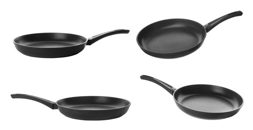 Image of Set with new frying pans on white background