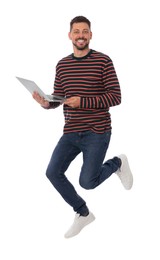 Photo of Handsome man with laptop jumping on white background