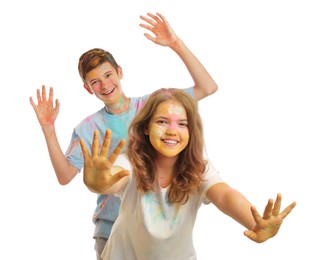 Happy teens covered with colorful powder dyes on white background. Holi festival celebration