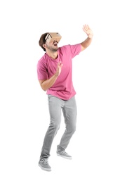 Photo of Young man using cardboard virtual reality headset, isolated on white