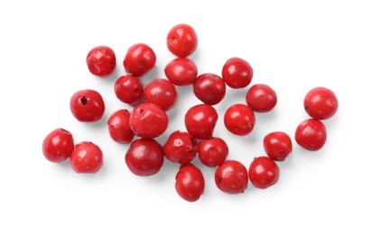 Aromatic spice. Many red peppercorns isolated on white, top view