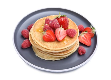 Tasty pancakes with fresh berries and honey on white background