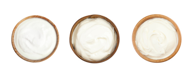 Image of Set of delicious natural yogurt in bowls on white background, top view