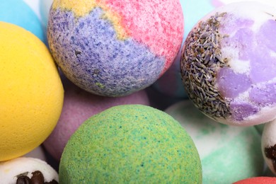 Photo of Colorful bath bombs as background, above view