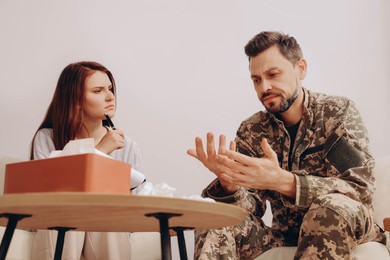 Psychologist working with military officer in office