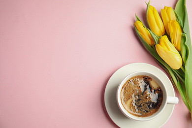Photo of Aromatic morning coffee and beautiful tulips on pink background, flat lay. Space for text