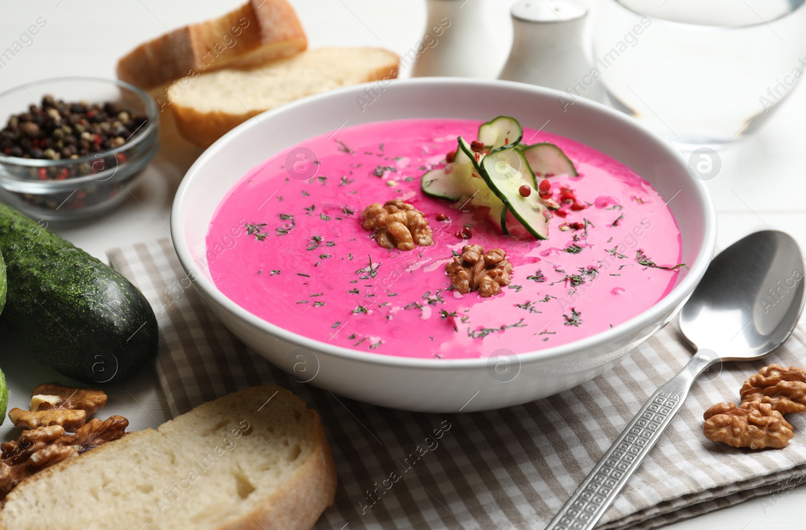 Photo of Delicious cold summer beet soup on table