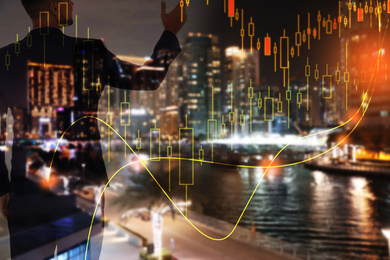 Image of Forex trading. Charts and double exposure of man with night city