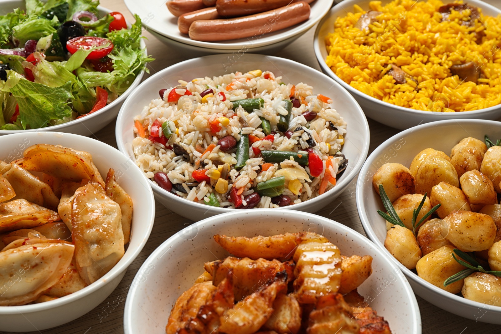 Photo of Different delicious dishes on table, closeup. Buffet service