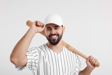 Photo of Man in stylish baseball cap holding bat on white background