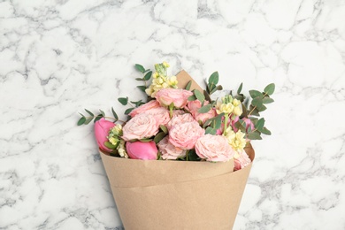 Photo of Bouquet of beautiful fragrant flowers on marble background