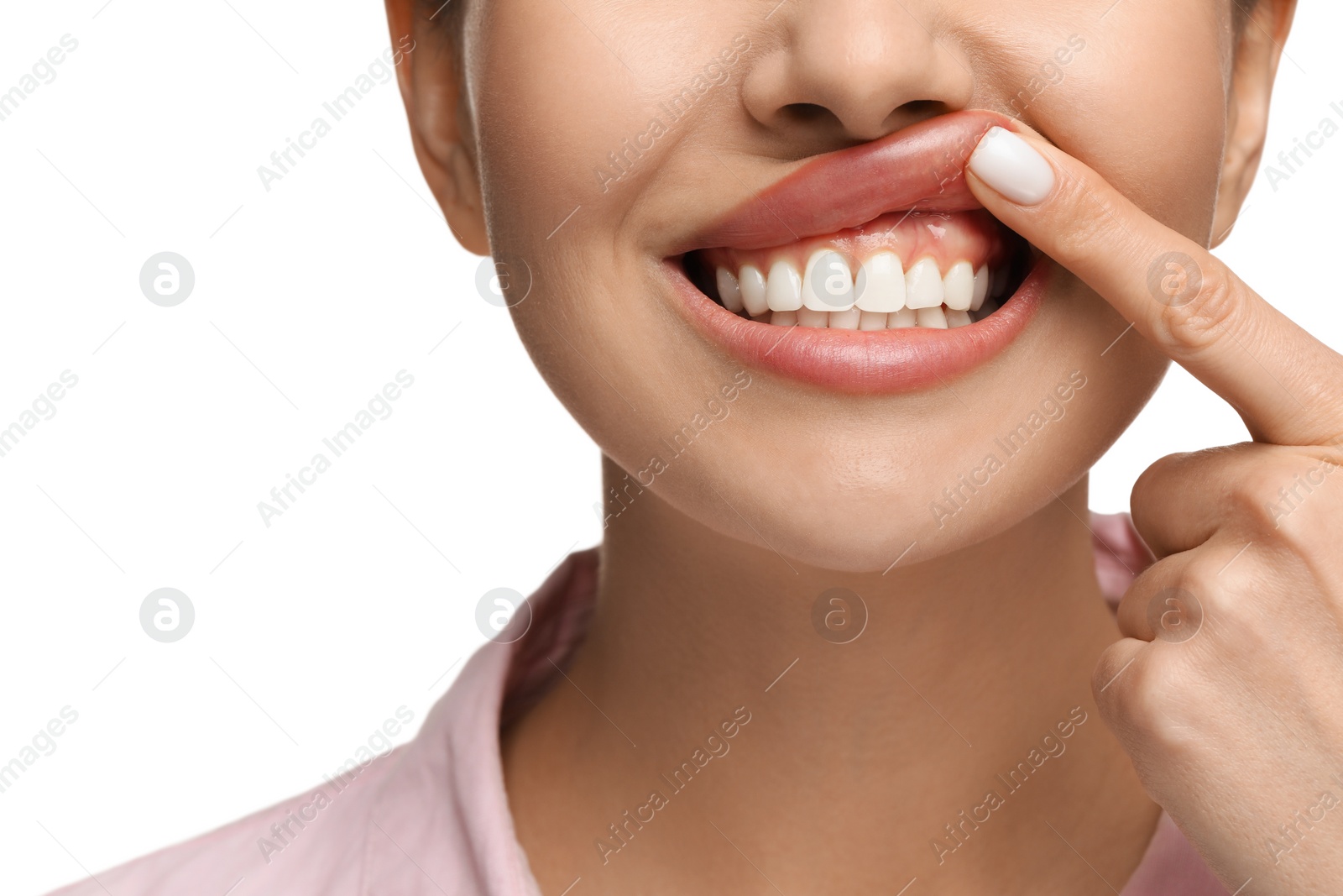 Photo of Woman showing her clean teeth on white background, closeup