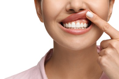 Photo of Woman showing her clean teeth on white background, closeup