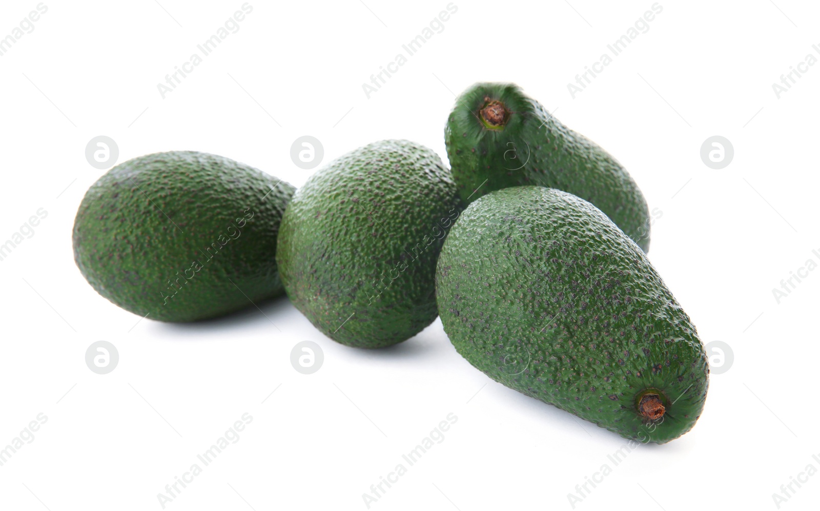 Photo of Ripe avocados on white background. Tropical fruit