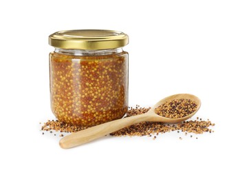 Fresh whole grain mustard in jar, spoon and dry seeds isolated on white