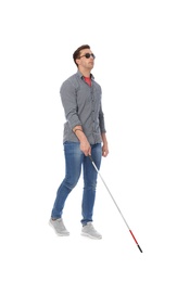 Photo of Young blind person with long cane walking on white background