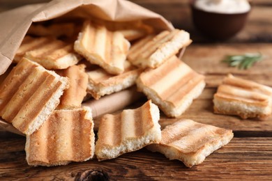 Delicious pita chips on wooden table, closeup