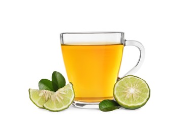 Photo of Glass cup of bergamot tea and fresh fruit on white background