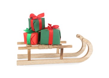 Wooden sleigh with presents on white background. Christmas holiday decor