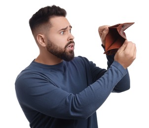 Confused man showing empty wallet on white background