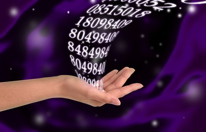 Image of Numerology. Woman holding flow of numbers against abstract background, closeup