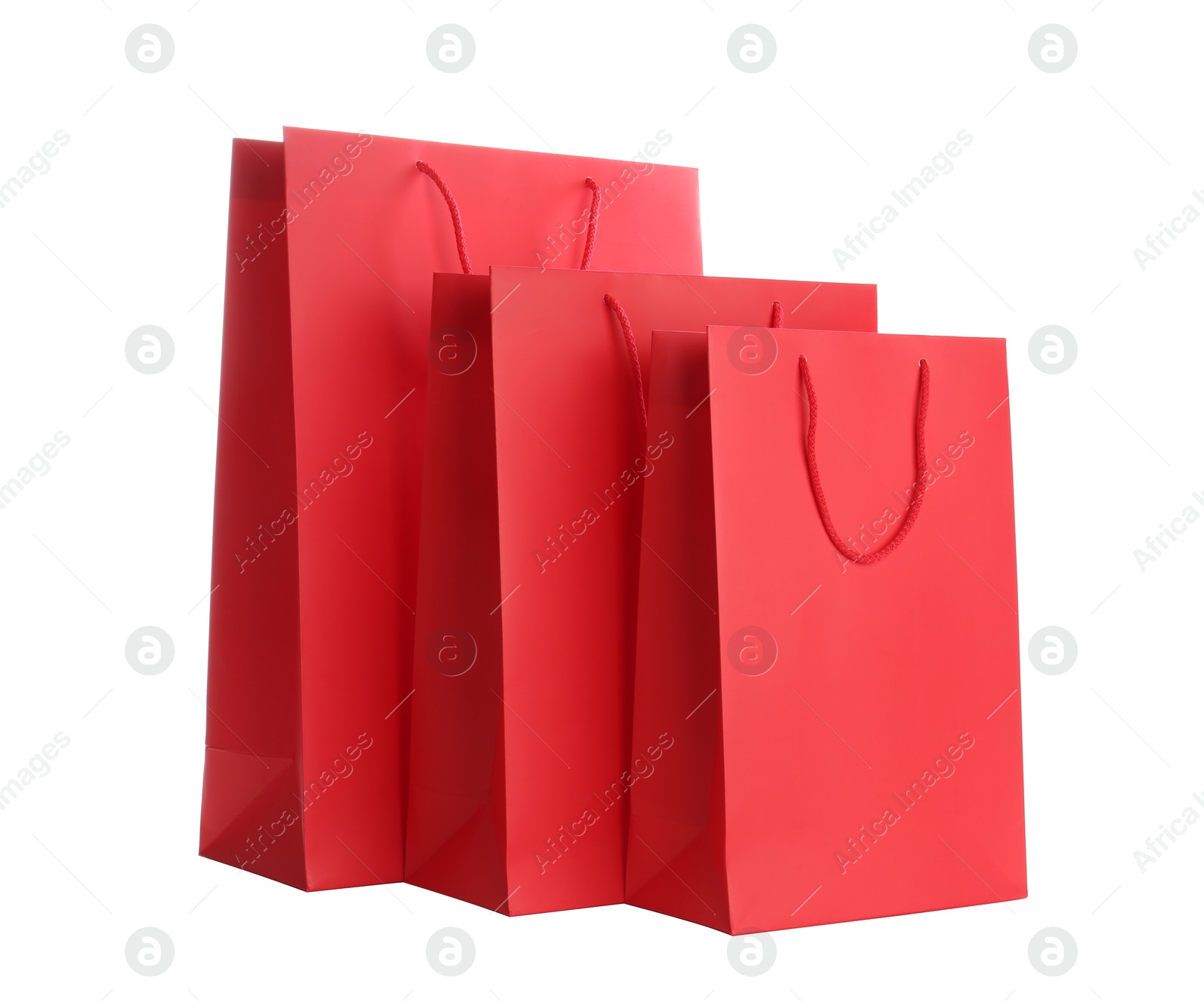 Photo of Red paper shopping bags isolated on white