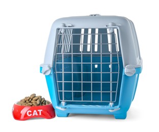 Light blue pet carrier and bowl of dry food isolated on white