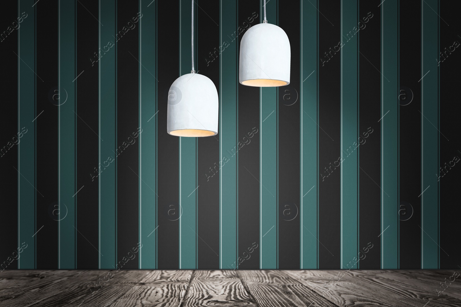 Image of Stylish pendant lamps hanging near striped wall in room