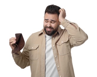 Confused man showing empty wallet on white background