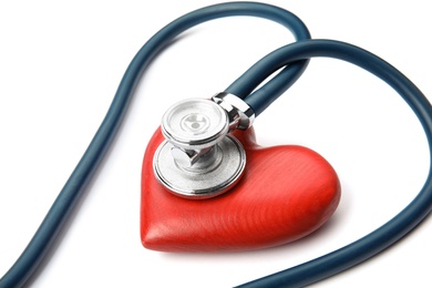 Photo of Red heart and stethoscope on white background. Cardiology concept