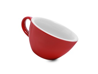 Photo of One red ceramic cup isolated on white