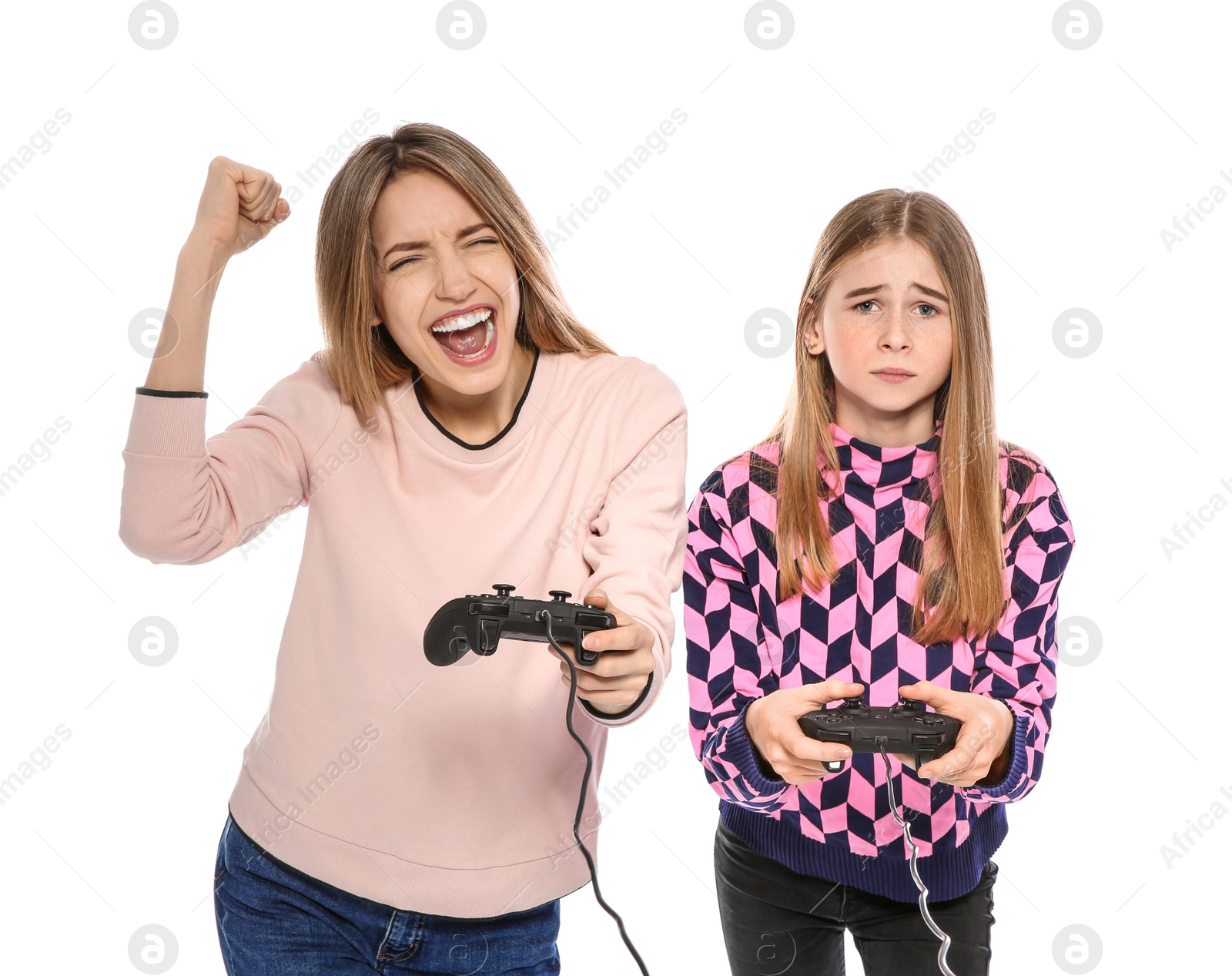 Photo of Young woman and teenage girl playing video games with controllers isolated on white
