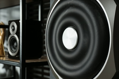 Photo of Modern powerful subwoofer indoors, closeup. Audio speaker system