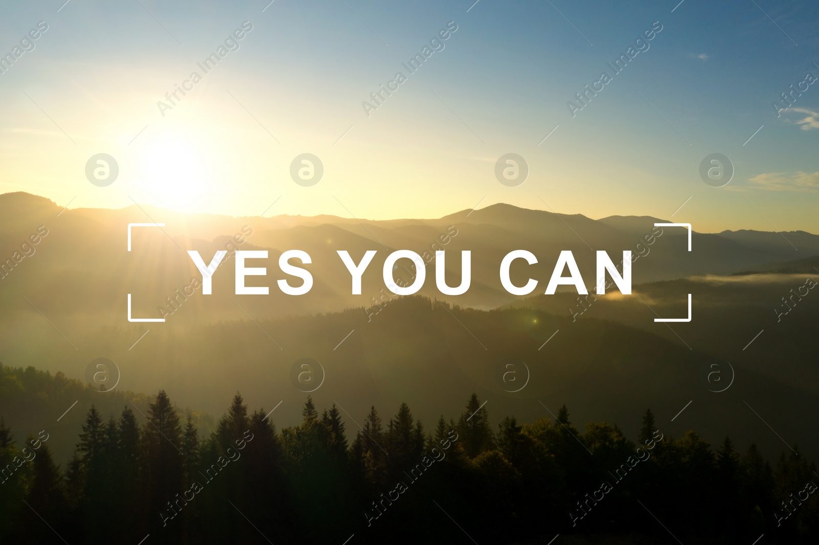 Image of Yes You Can. Motivational quote inspiring to believe in yourself. Text against beautiful mountain landscape at sunrise