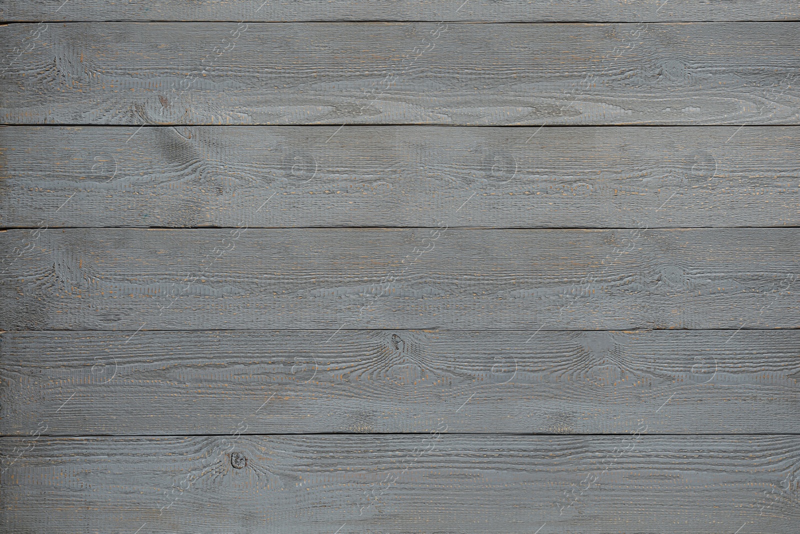 Photo of Texture of grey wooden board on black background, top view