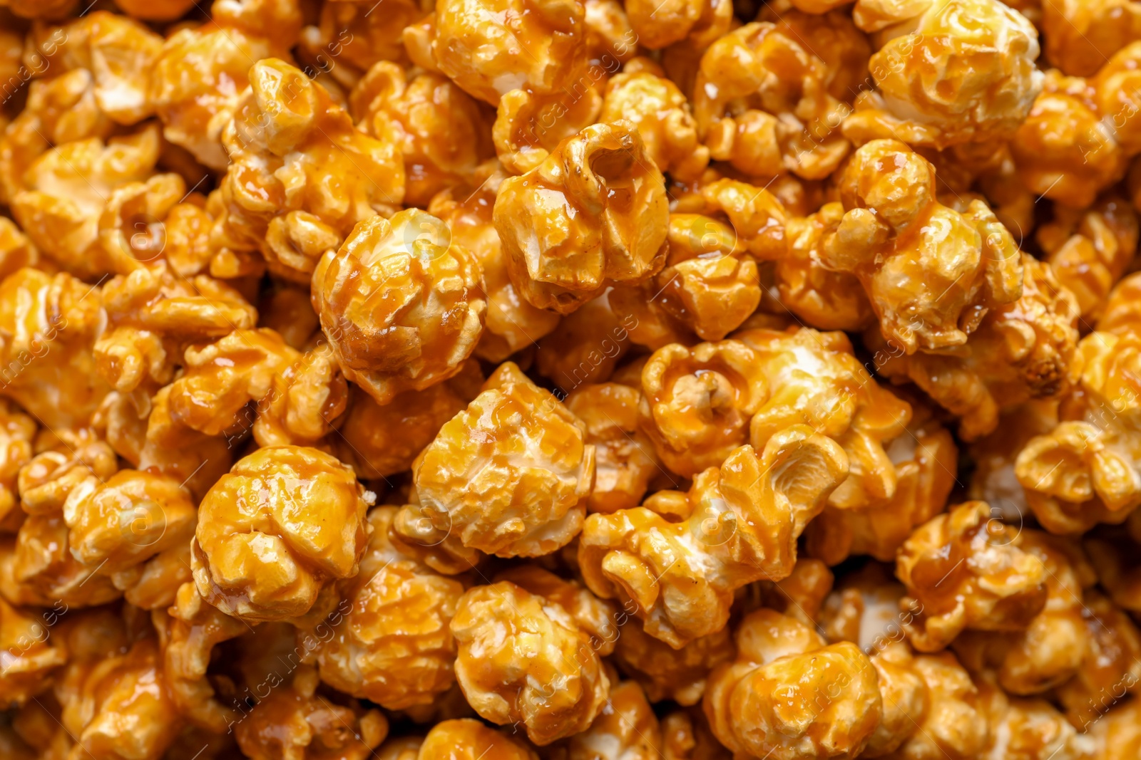 Photo of Yummy popcorn with caramel as background