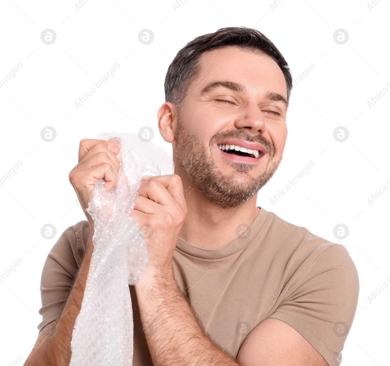 Photo of Happy man with bubble wrap on white background