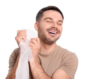 Happy man with bubble wrap on white background