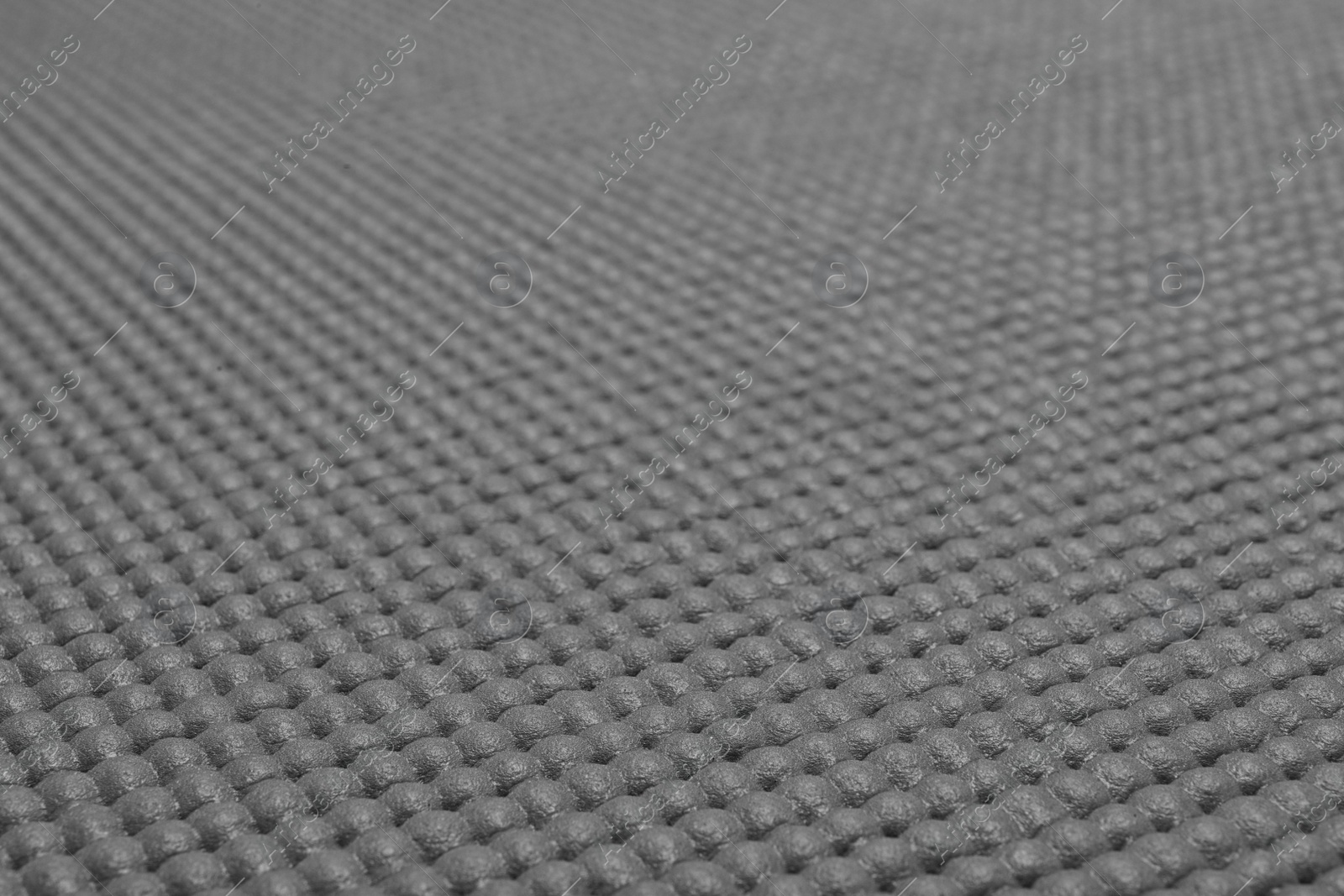 Photo of Grey sports mat texture as background, closeup