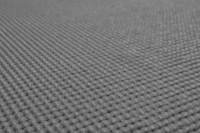 Photo of Grey sports mat texture as background, closeup