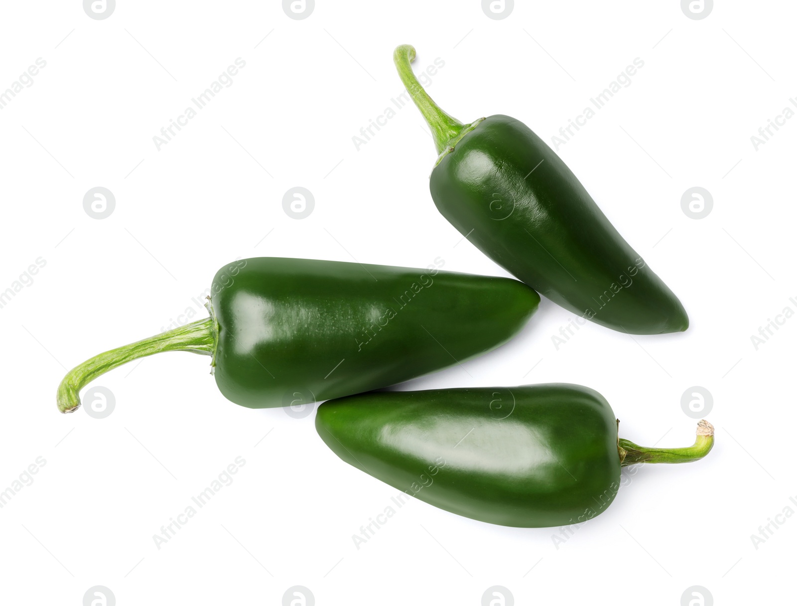 Photo of Ripe green hot chili peppers on white background, top view