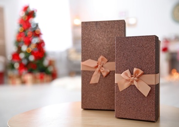 Gift boxes and blurred Christmas tree on background