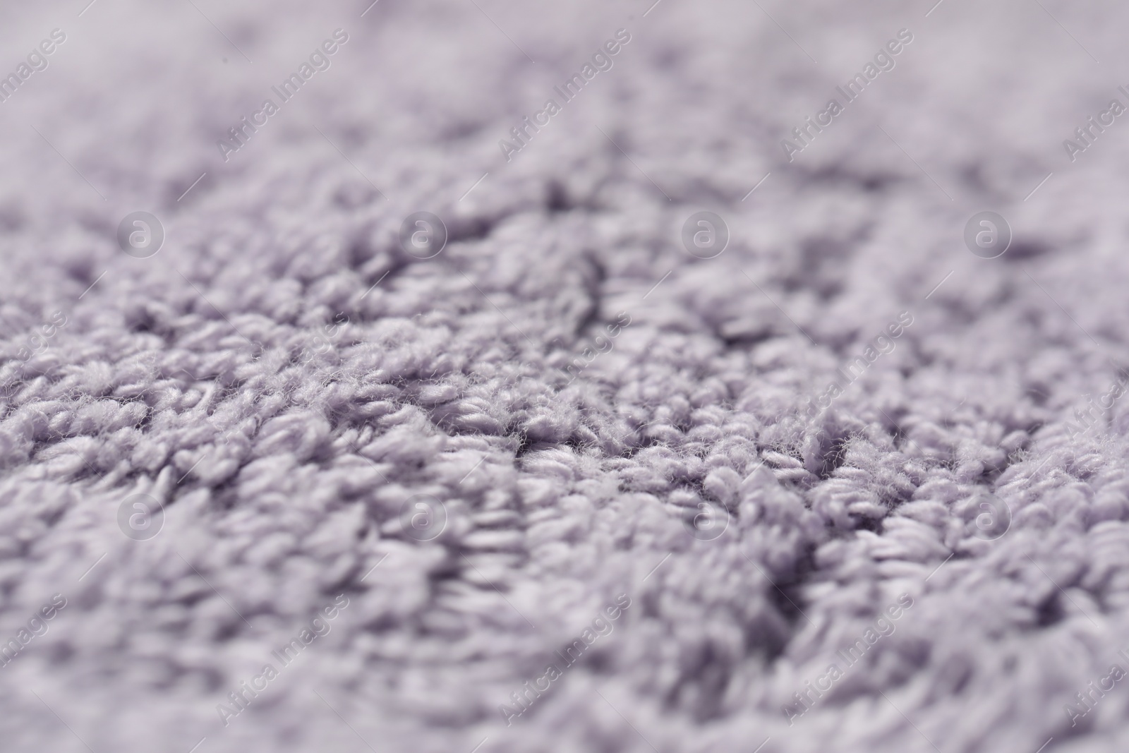 Photo of Texture of soft violet fabric as background, closeup