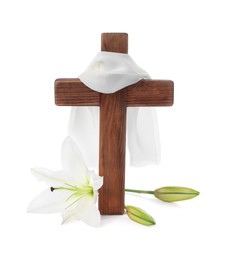 Photo of Wooden cross, cloth and lily flowers on white background. Easter attributes