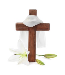 Wooden cross, cloth and lily flowers on white background. Easter attributes