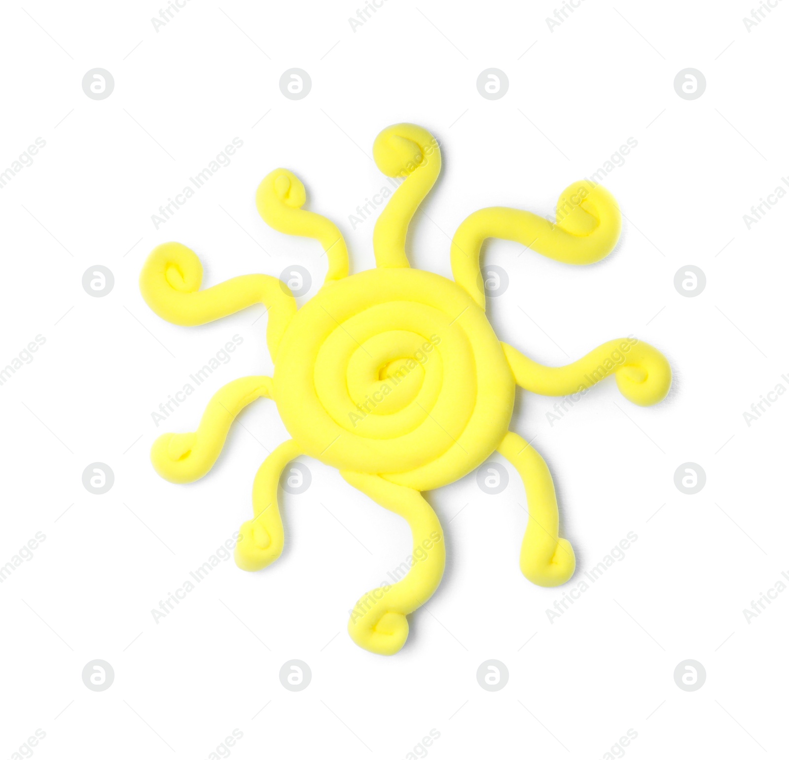 Photo of Yellow sun made from play dough on white background, top view