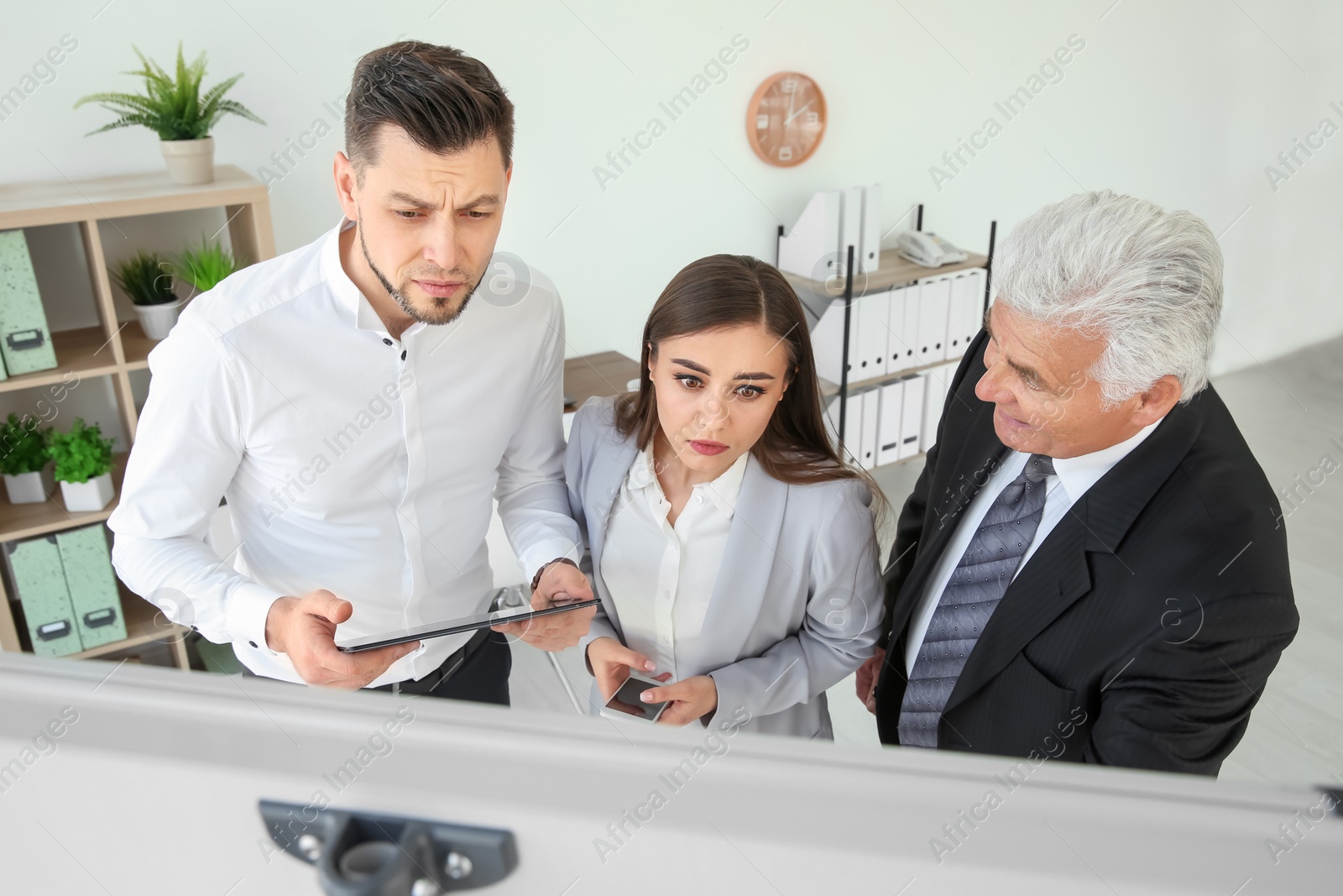 Photo of Office employees having argument at workplace